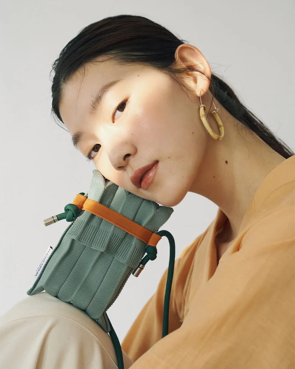 Knit Pleated Phone Bag made from Recycled Ocean Plastic - Tangerine