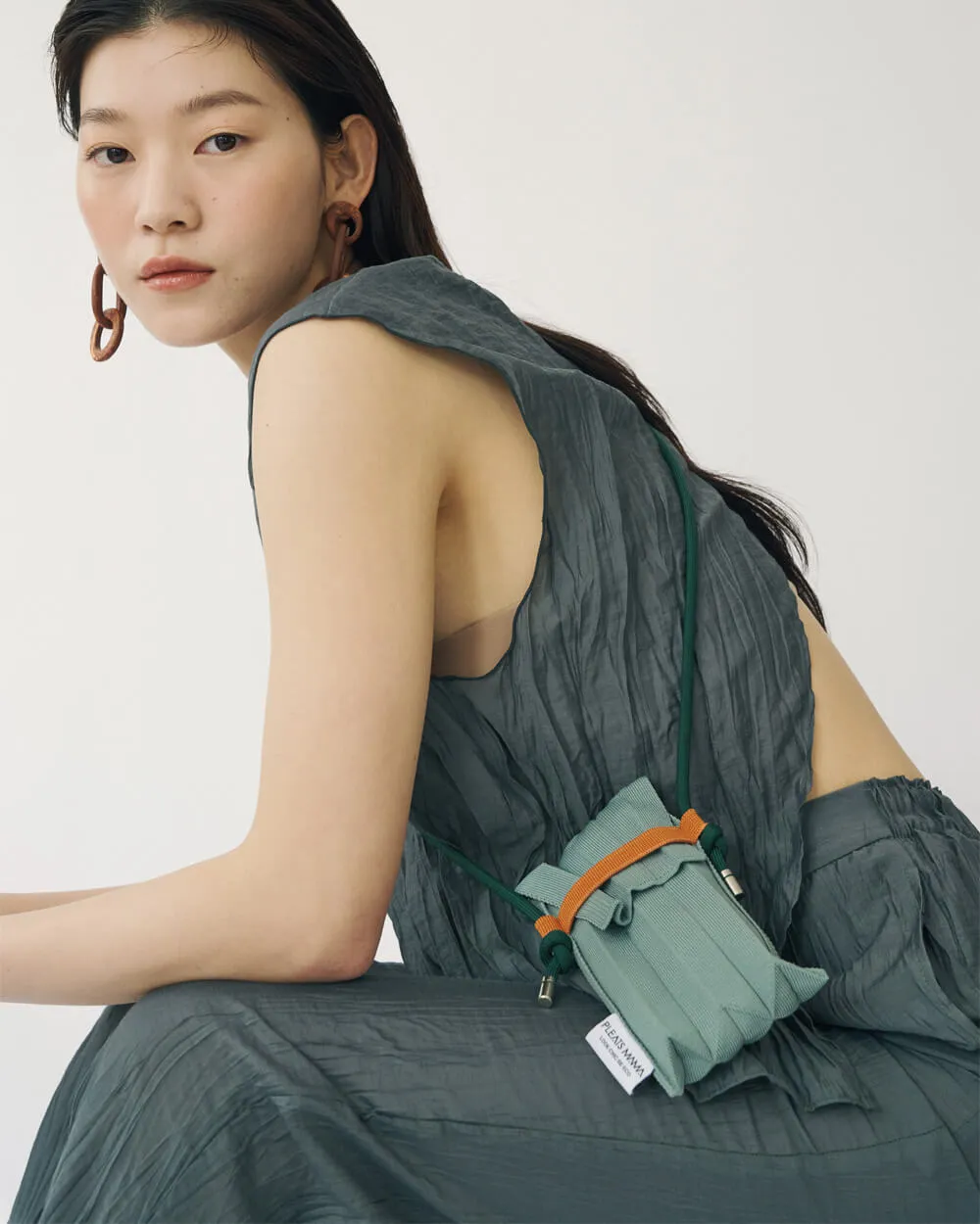 Knit Pleated Phone Bag made from Recycled Ocean Plastic - Tangerine
